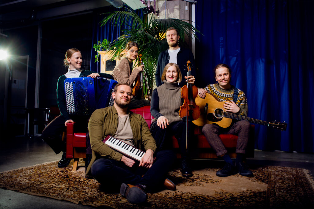 A group photo of musicians from the Lapua Uusi-Guinea band.