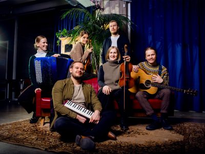 A group photo of musicians from the Lapua Uusi-Guinea band.